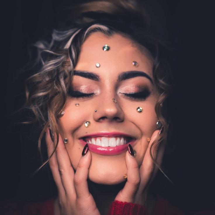 Mira Sen, Lead Design Curator at MarketMirrorCandle, reviewing corporate floral arrangements